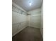 Walk-in closet with wire shelving for organized storage of clothing and accessories at 3722 Cherokee Overlook Dr, Canton, GA 30115