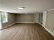 Spacious basement with neutral walls, large window, and sliding door for easy access to the backyard at 1387 Renee Dr, Decatur, GA 30035