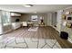 Finished basement with sleek floors, built-in shelves, and a comfortable seating area at 1387 Renee Dr, Decatur, GA 30035