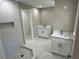 Renovated bathroom featuring a tiled shower, dual vanities, and modern fixtures at 1387 Renee Dr, Decatur, GA 30035