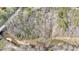 Aerial perspective showcasing stream running near property at 176 Old Burnt Hickory Rd, Douglasville, GA 30134