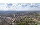Aerial perspective highlighting expansive tree coverage surrounding the property at 176 Old Burnt Hickory Rd, Douglasville, GA 30134