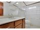 Cozy bathroom featuring a single vanity, mirror, toilet, and shower with bathtub at 1925 Stonewyck Ct, Cumming, GA 30041