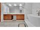 Bright bathroom boasts double vanity, soaking tub, and sleek fixtures for a luxurious feel at 1925 Stonewyck Ct, Cumming, GA 30041