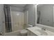 Bathroom featuring a tub and shower, a sink, and updated fixtures at 2157 Brandon Lee Sw Dr, Marietta, GA 30008