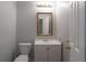 Updated bathroom with vanity sink, framed mirror, and new toilet at 2157 Brandon Lee Sw Dr, Marietta, GA 30008