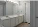 Bathroom featuring double sinks, white cabinets, a large mirror, and fresh paint at 2157 Brandon Lee Sw Dr, Marietta, GA 30008