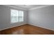 Bright bedroom with hardwood floors and a large window at 2157 Brandon Lee Sw Dr, Marietta, GA 30008