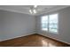 Comfortable bedroom features a ceiling fan, hardwood floors, and a large window at 2157 Brandon Lee Sw Dr, Marietta, GA 30008