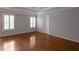 Spacious bedroom boasting hardwood floors, tray ceiling, and ample natural light at 2157 Brandon Lee Sw Dr, Marietta, GA 30008