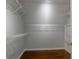 Walk in closet featuring wood flooring, wire shelving, and fresh paint at 2157 Brandon Lee Sw Dr, Marietta, GA 30008