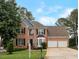 Charming two-story brick home with a well-manicured lawn and attached two-car garage at 2157 Brandon Lee Sw Dr, Marietta, GA 30008