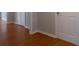 The hallway features attractive wood flooring and white doors and trim at 2157 Brandon Lee Sw Dr, Marietta, GA 30008
