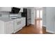 Modern kitchen featuring white appliances, an oven, and hardwood floors at 2157 Brandon Lee Sw Dr, Marietta, GA 30008