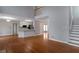 Bright living area with hardwood floors, a staircase, and an open layout to the kitchen at 2157 Brandon Lee Sw Dr, Marietta, GA 30008