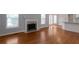 Spacious living area with hardwood floors, a fireplace, and an open floor plan at 2157 Brandon Lee Sw Dr, Marietta, GA 30008