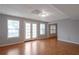 Bright living room featuring hardwood floors, french doors, and large windows at 2157 Brandon Lee Sw Dr, Marietta, GA 30008