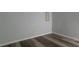 A serene gray room is accentuated by stylish plank flooring and neutral wall decor at 2157 Brandon Lee Sw Dr, Marietta, GA 30008