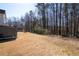 View of a spacious backyard with mature trees creating a private and serene environment at 3519 Wellsley Dr, Powder Springs, GA 30127