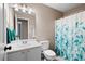 Cozy bathroom features a vanity sink, toilet, and shower-tub combo, creating a functional and clean space at 3519 Wellsley Dr, Powder Springs, GA 30127