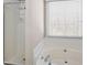 Bathroom features a shower, bathtub, and a bright window, creating a relaxing and functional space at 3519 Wellsley Dr, Powder Springs, GA 30127