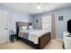 Cozy bedroom offers a relaxing retreat with a comfortable bed, soft lighting, and ample closet space at 3519 Wellsley Dr, Powder Springs, GA 30127