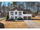 Charming two-story white brick home with a well-manicured lawn and a two-car garage at 3519 Wellsley Dr, Powder Springs, GA 30127