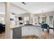 Modern kitchen with stainless steel dishwasher and view to dining and living spaces at 3519 Wellsley Dr, Powder Springs, GA 30127