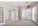 Bright and airy office space with neutral walls, plush carpeting, and French doors at 3519 Wellsley Dr, Powder Springs, GA 30127