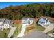 Aerial view showcases this charming home nestled in a well-manicured neighborhood at 410 Ward Farm Dr, Powder Springs, GA 30127
