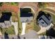 An aerial view displays a beautifully landscaped home and neighborhood at 410 Ward Farm Dr, Powder Springs, GA 30127