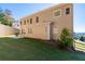 Landscaped backyard with retaining wall, patio, grill, and well-maintained lawn at 410 Ward Farm Dr, Powder Springs, GA 30127