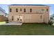 Expansive backyard with grill, features ample green space extending from the home's rear at 410 Ward Farm Dr, Powder Springs, GA 30127