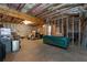 Unfinished basement provides ample potential, featuring exposed beams and stud walls for future customization at 410 Ward Farm Dr, Powder Springs, GA 30127
