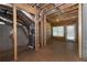 Unfinished basement with visible ducts, an exit door, and a window allowing natural light at 410 Ward Farm Dr, Powder Springs, GA 30127