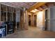 Unfinished basement with open staircase, offering opportunity for customization at 410 Ward Farm Dr, Powder Springs, GA 30127