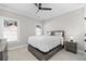 Comfortable bedroom with a full-size bed, windows, and neutral color scheme, creating a relaxing atmosphere at 410 Ward Farm Dr, Powder Springs, GA 30127