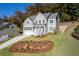 Lovely home with a two-car garage and landscaped front yard at 410 Ward Farm Dr, Powder Springs, GA 30127