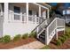 Inviting entry with bright white brick stairs leading up to front porch at 410 Ward Farm Dr, Powder Springs, GA 30127