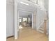 An open floor plan featuring a staircase and sun-filled living area at 410 Ward Farm Dr, Powder Springs, GA 30127