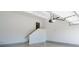 Bright, clean garage space with staircase leading to another level, and automatic garage door at 410 Ward Farm Dr, Powder Springs, GA 30127