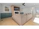 Open-concept living room with hardwood floors, fireplace, built-in cabinets, and view to the front entry at 410 Ward Farm Dr, Powder Springs, GA 30127