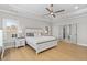 Inviting primary bedroom with tray ceilings, natural light, and luxury en suite bathroom at 410 Ward Farm Dr, Powder Springs, GA 30127