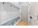 Mudroom with custom built-in storage, bench seating, and hooks for organization at 410 Ward Farm Dr, Powder Springs, GA 30127