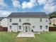 Spacious backyard featuring a large patio area ideal for outdoor dining and entertaining at 7104 Secret Rose, Douglasville, GA 30134