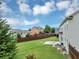 A serene view of the backyard, complete with a picnic table on the stone patio at 7104 Secret Rose, Douglasville, GA 30134