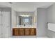 Bathroom with dual sinks, and a large mirror at 7104 Secret Rose, Douglasville, GA 30134