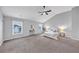 Spacious primary bedroom with a ceiling fan, gray walls, and large windows at 7104 Secret Rose, Douglasville, GA 30134