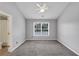 Bedroom featuring carpet, ceiling fan, neutral paint, and lots of natural light, creating a relaxing space at 7104 Secret Rose, Douglasville, GA 30134