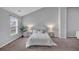 Bright bedroom featuring a large bed, gray walls, a ceiling fan, and natural light at 7104 Secret Rose, Douglasville, GA 30134